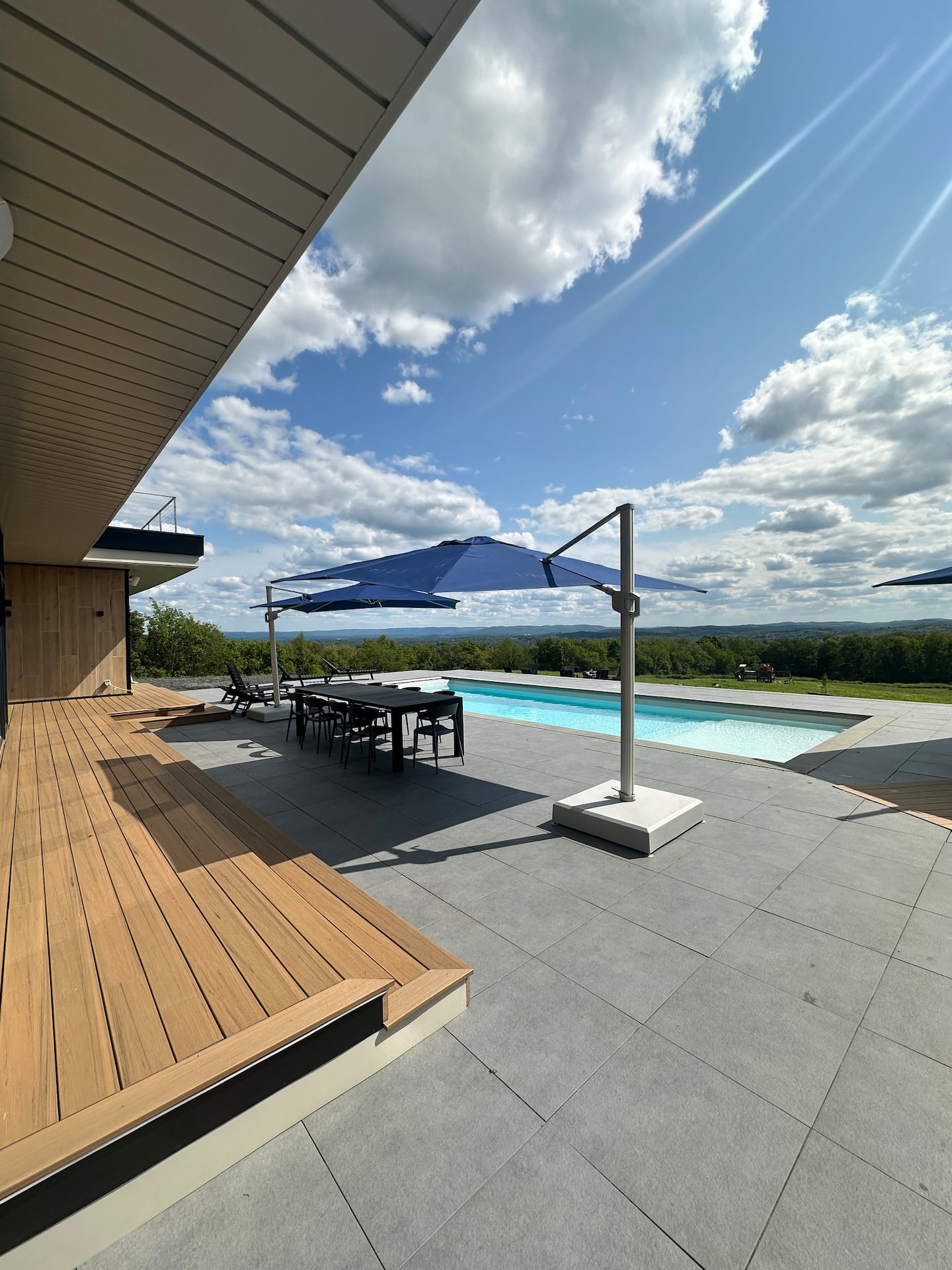 Pool and blue umbrellas