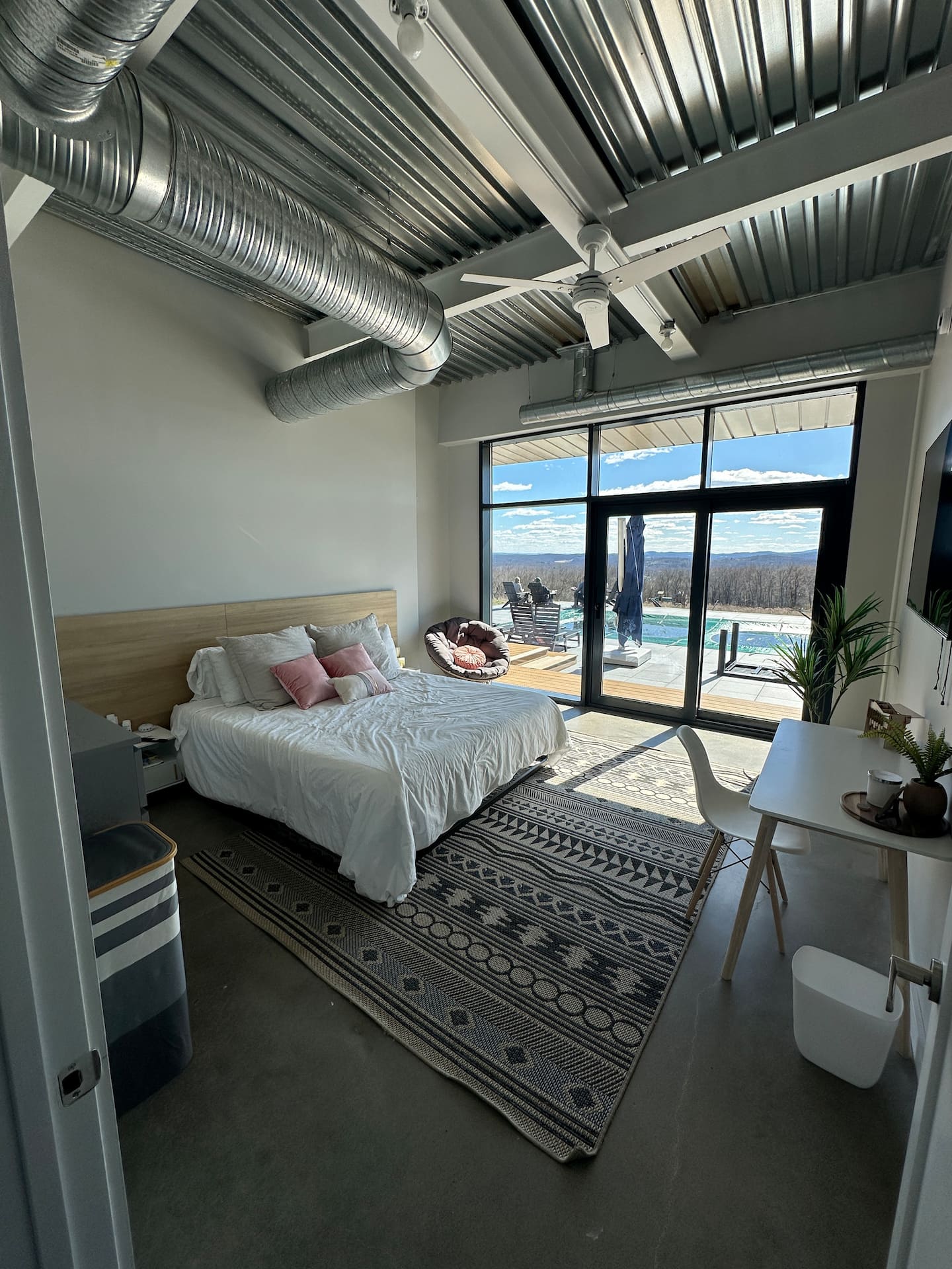 Bedroom with floor-to-ceiling glass